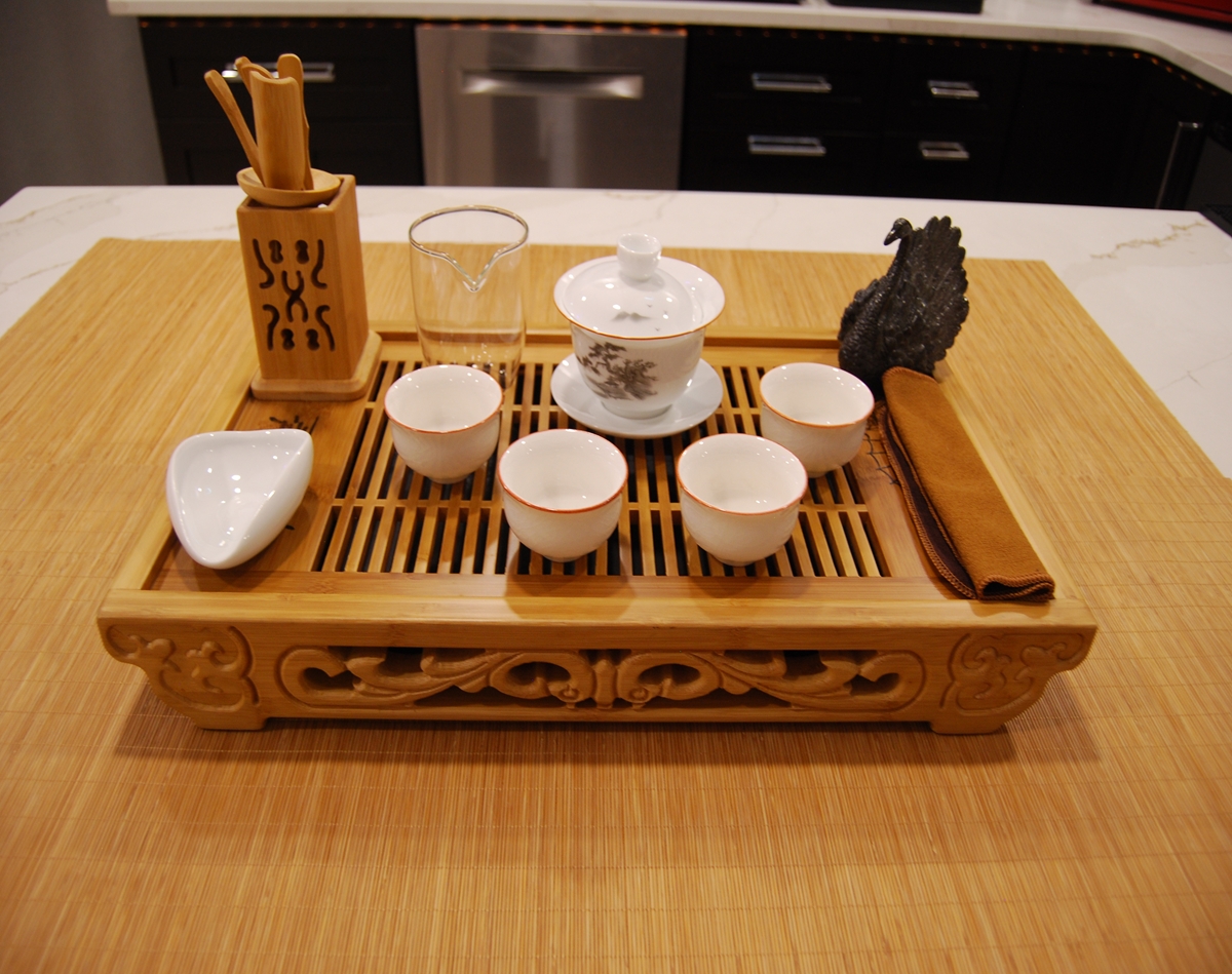The Quiet Brush Ritual Set ceremonial tea set with bamboo tray, painted porcelain gaiwan, glaze cups, glass fairness cup, and swan tea pet
